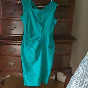 Haute Asymetric Teal Sm Stretch sleeveless dress never worn front pleats